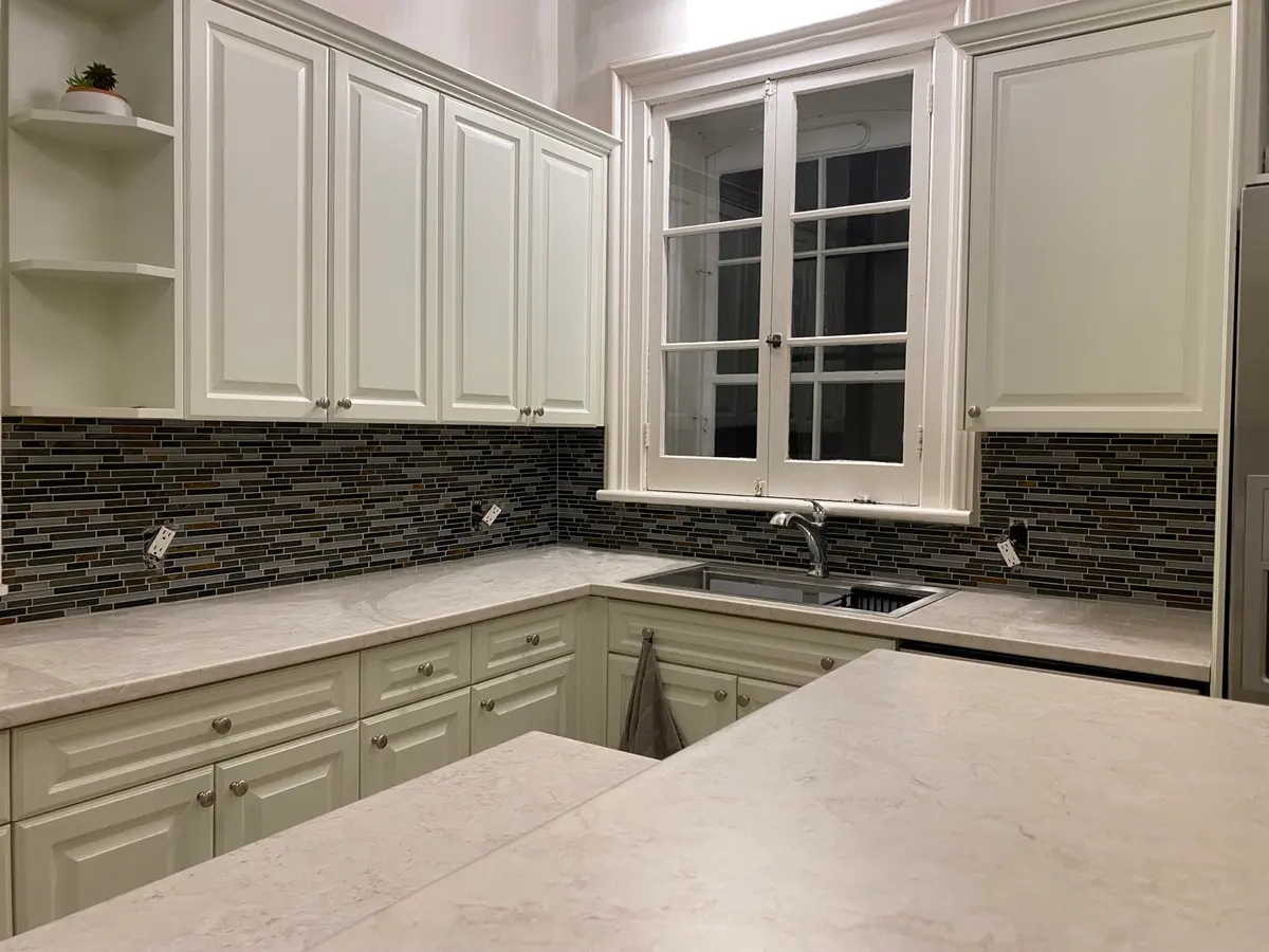 Mosaic kitchen backsplash around cabinetry from the BL Renovations gallery